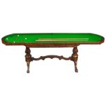 A Rosewood Dining/Billiard Table: 19th century, the lift up top enclosing green baize,