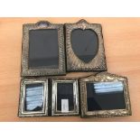 Four HM silver photograph frames