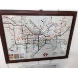 A London Underground tube map in a wooden frame