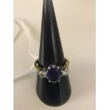 An 18ct blue stone and diamond dress ring