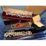 A quantity of coral, pearl and lapis necklaces, some with 9ct clasps, boxed pearls,