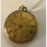 A 9ct gold pocket watch movement marked Tissot