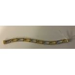 A 9ct bi-gold rectangle link bracelet