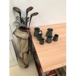 A set of vintage golf clubs;