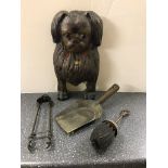 A Victorian cast-iron dog fire companion set