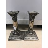 A pair of Corinthian column HM silver candlesticks