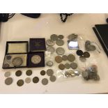 A quantity of coins to inc a Peace Dollar