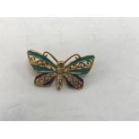 A 14kt diamond butterfly brooch