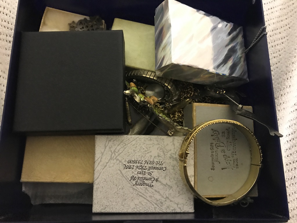 A box of costume jewellery to inc a gold pendant and chain, gold rings and a quantity of pendants,