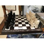 A chess set with carved pieces
