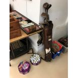 A quantity of vintage golf clubs,