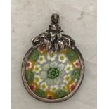 A silver millefiori pendant