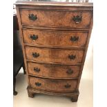 A 1920s walnut five-drawer chest