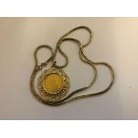 An 1889 gold sovereign mounted in a 9ct mount and 9ct gold chain