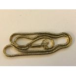 A gold snake link necklace