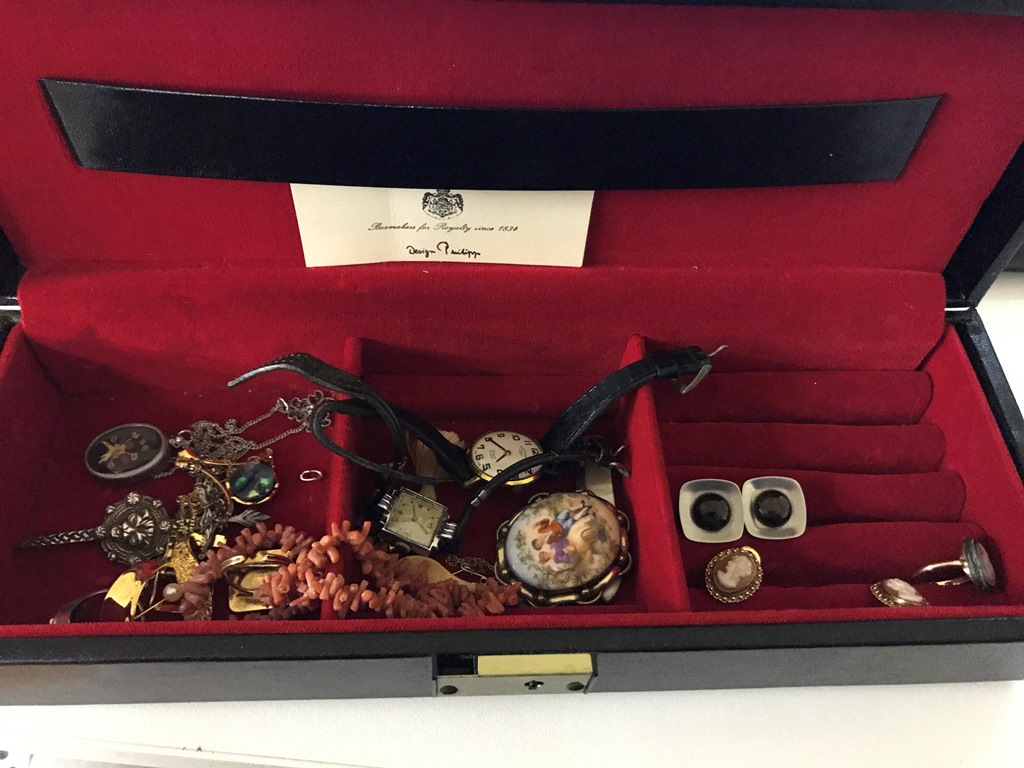 A box of vintage costume jewellery and watches