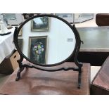 An edwardian mahogany swing mirror