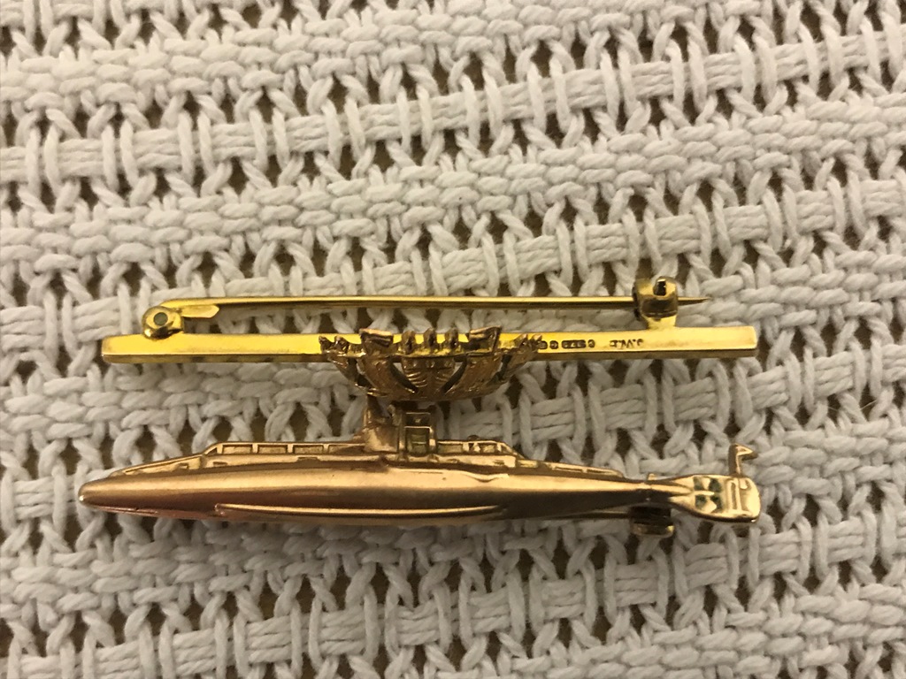 A 9ct submarine and MN bar brooch