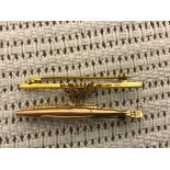 A 9ct submarine and MN bar brooch