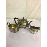 A HM silver three-piece tea service by the Goldsmith & Silversmith Co (kettle A/F)