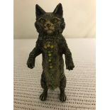 A cold-painted bronze pin cushion in the form of a cat,