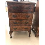 A 1920s walnut chest of drawers