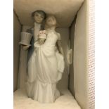 A boxed Lladro bride and groom