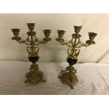 A pair of three sconce candelabra