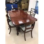 A Victorian mahogany dining table and extra leaf;