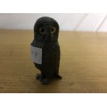 A pewter pepperette in the form of an owl,