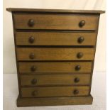 A miniature oak chest chest of drawers