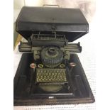 A Junior tin plate typewriter