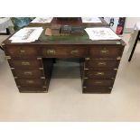 A mahogany leather-topped twin pedestal desk