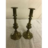 A pair of brass candlesticks