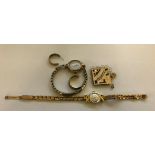 A 9ct gold ladies wristwatch, brooch,