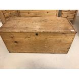 A large antique pine trunk with candle box