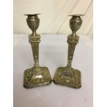 A pair of HM silver candlesticks