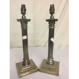 A pair of Corinthian column lamps,