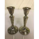 A pair of HM silver candlesticks