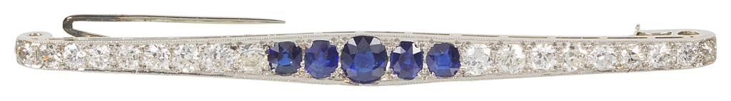 An Art Deco Sapphire and Diamond Bar Brooch: Comprising eighteen graduated fine white brilliant cut