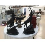 Two large bronze figures of stags on marble bases