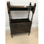 A 1940s oak magazine rack