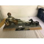 An Art Deco figure of a reclining lady and greyhound