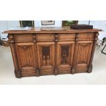 A Victorian oak Gothic revival desk in the manner of Pugin,