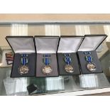 Four cased USA FOI military achievement medals,