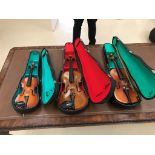 Three cased violins: one Czech,