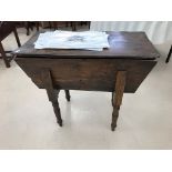 An 18th century elm dough bin with later legs