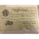 A white £5 note dated 16th January 1950 (framed and glazed)