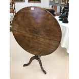 A 19th century tilt-top table