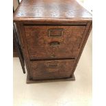 An oak two-drawer filing cabinet